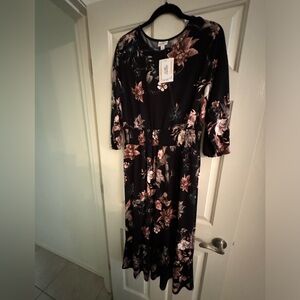 Evelyn Lularoe dress with sleeves , black background   Floral .